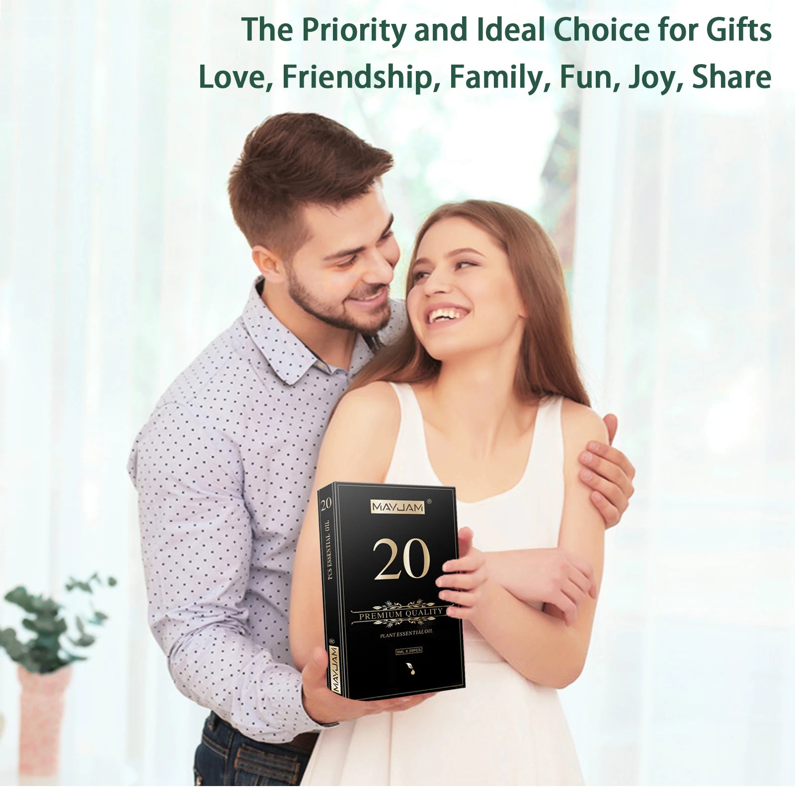 Smiling couple in bright room holding black essential oils gift box, happy and relaxed atmosphere