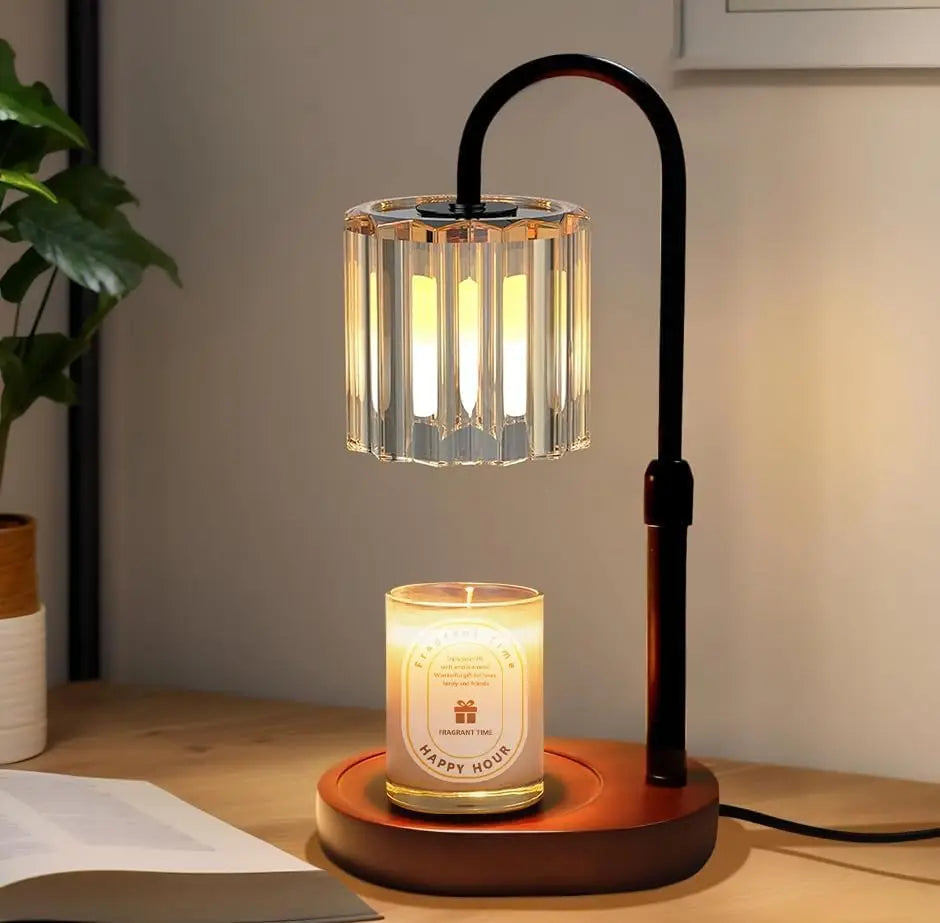 Crystal lamp and lit candle on wooden desk, cozy home decor for relaxing ambiance