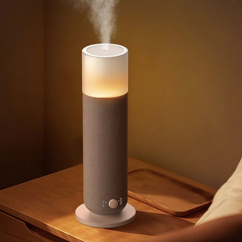 Smart aroma diffuser and humidifier with soft light on nightstand, app-controlled