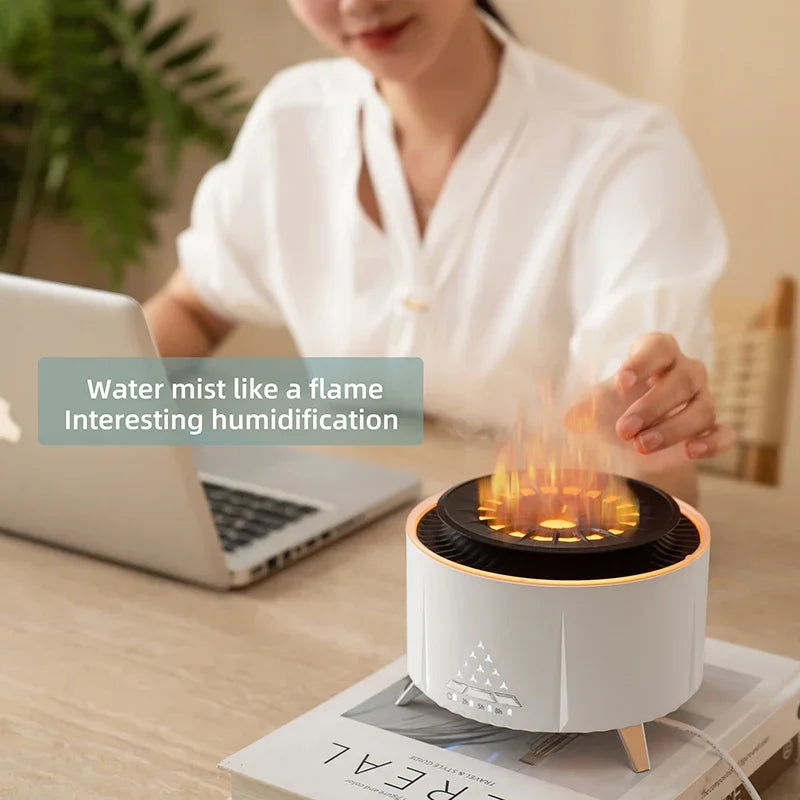 Flame-effect humidifier on desk by woman with laptop, modern home workspace accessory